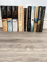Spines of all ten hardcover books standing side by side
