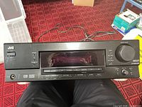 Front view of JVC RX-6030VBK receiver showing display, controls and headphone jack