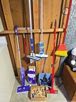 Group shot of all standing cleaning tools, bin, pad box and clothespins