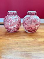 Front view of both ginger jars showing red scenic transfer pattern