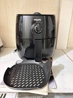 Front view of Philips air fryer with basket/tray removed