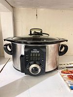 Rival Crock-Pot stainless steel slow cooker with lid on tabletop