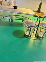 Overall view of chafing dish on stand with embossed lid and separate condiment jar set