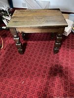 Full view of side table on red carpet