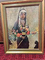 Front view of framed oil painting depicting Bedouin girl
