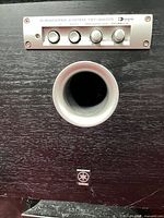 Front view of Yamaha YST-SW015 subwoofer showing port and control panel