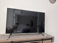 Front view of 50" TV on stand