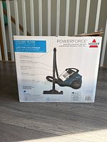 Box showing Bissell PowerForce canister vacuum image and specs