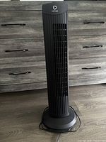 Front view of Fantask black tower fan showing grille and base