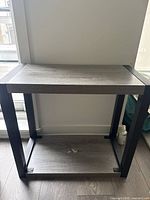 Overall view of side table showing top, shelf, frame