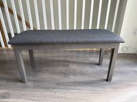 full side view of bench showing frame and upholstery