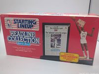 Front of sealed box showing product name and contents image