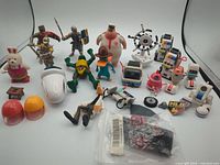 Full lot overview showing knights, TMNT, Perry, EVE, sailor, rabbit, robots and accessories