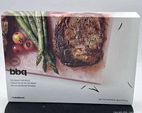 Front of boxed Crate & Barrel pink Himalayan salt block showing product image and branding