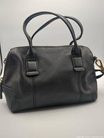 Front view of Fossil black leather satchel with handles