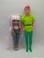 Full view of both dolls side by side displaying overall condition and size comparison