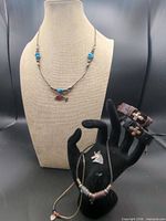 Full lot showing necklaces on bust, leather bracelets, unicorn pendant
