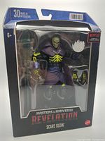 Front view of sealed Scare Glow figure in box