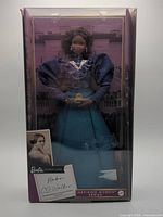 Front view of boxed Madam C.J. Walker Barbie doll