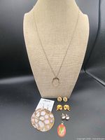 Full lot on display bust showing necklace and all earrings