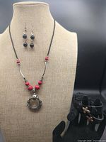 Full set displayed: necklace, earrings, two bracelets