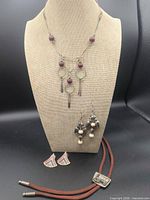 All jewellery pieces together on display bust