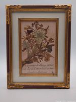 Frontal view of framed pressed flower artwork