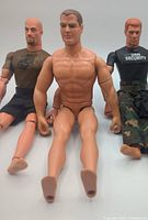 Front view of all three GI Joe figures seated