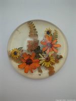 Top view showing floral arrangement inside Lucite dome