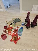 All items laid out including berry trees, plate, coasters, bottle sweaters, garland, bags and more