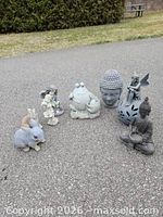 Group shot of six garden statues