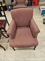 Front angled view showing seat, arms, legs