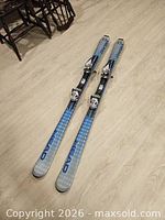 Full view of both skis showing topsheets and bindings