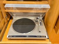 Top view of JVC L-A100 turntable with dust cover open