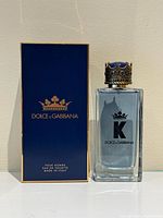 Bottle with cap beside branded box