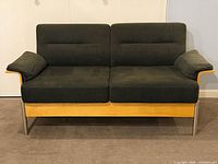 Front view of grey two-seat sofa, plywood frame, metal legs