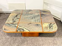 Top view showing nine marble tiles, teak dividers, rounded corners