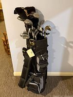 Full view of golf bag with clubs