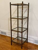 Full view of five-tier metal and glass shelf