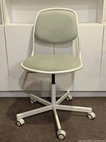 Front view of IKEA Örfjäll chair showing full form and base