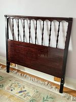 Headboard showing spindle design and finish