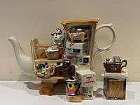 Front view of novelty teapot and tea caddy