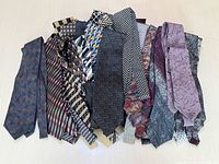 Pile of mixed patterned silk neckties