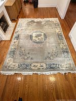 Full view of rectangular rug on floor showing overall design and size