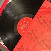 Red album record on red inner sleeve