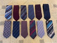 All twelve ties displayed in two rows for full pattern and colour view