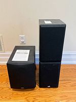PSB Alpha speakers stacked beside Definitive Technology ProSub 800 subwoofer