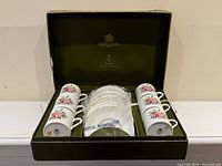 Open presentation box showing six cups and six saucers
