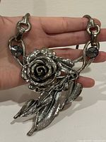 Front view showing rose pendant, leaves, chain links