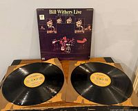 Front of gatefold album with two vinyl records displayed